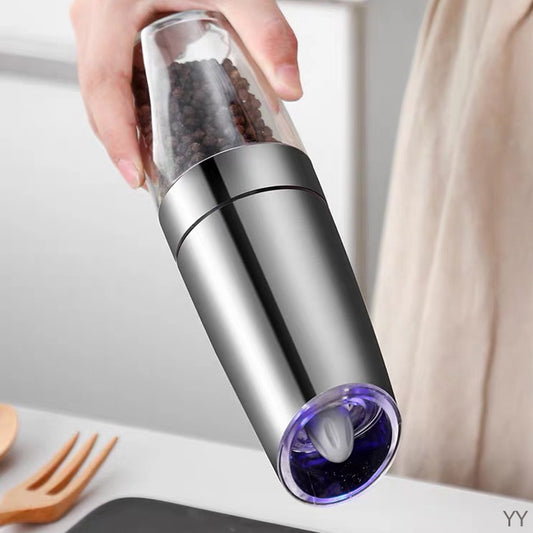 Automatic salt and pepper mill with gravity sensor